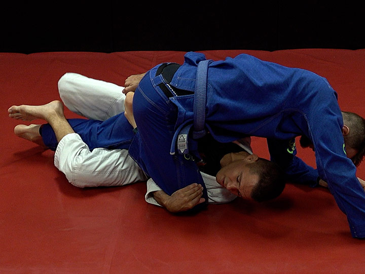 Coach James Clingerman demonstrating a basic Brazilian Jiu-Jitsu Half-Guard Sweep.